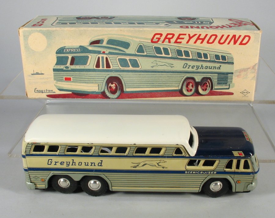 Cragstan Tin Greyhound Bus In Box: Cragstan made in Japan by Daiya Tin Greyhound friction bus. Crisp complete box. Measures 9 inches long.