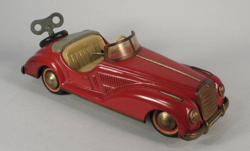 Distler Tin Mercedes Sports Convertible Car B-2727: Post War German Tin wind up 4 speed transmission with reverse, and steering. Ingenious clockwork car measures 10 inches long.