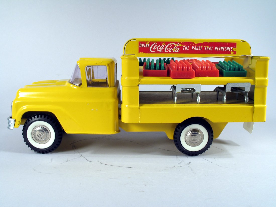 Buddy L Coca Cola Pressed Steel: 1950s Buddy L Coca Cola Truck with the Original Cases of Coke Bottles. Pressed steel truck is in excellent original condition, 15 inches long.