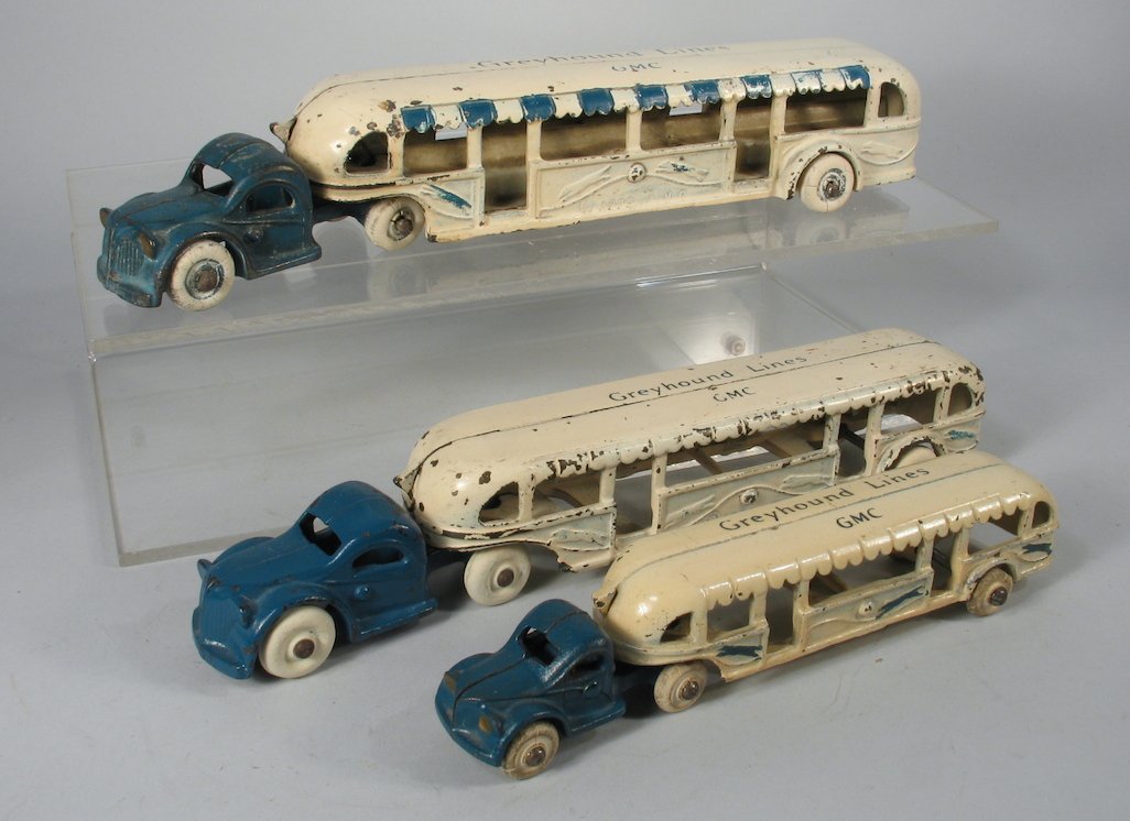 1933 Arcade GMC Greyhound Buses: 3 Arcade cast iron GMC Greyhounds. Meauring from 7 to 11 inches long.