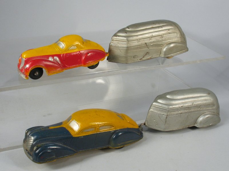 Pair of 1930s Car and Caravan Camping Trailers: Sun Rubber Caravan Trailers with 2-Tone Deco cars. Largest is 9 1/2 inches long.