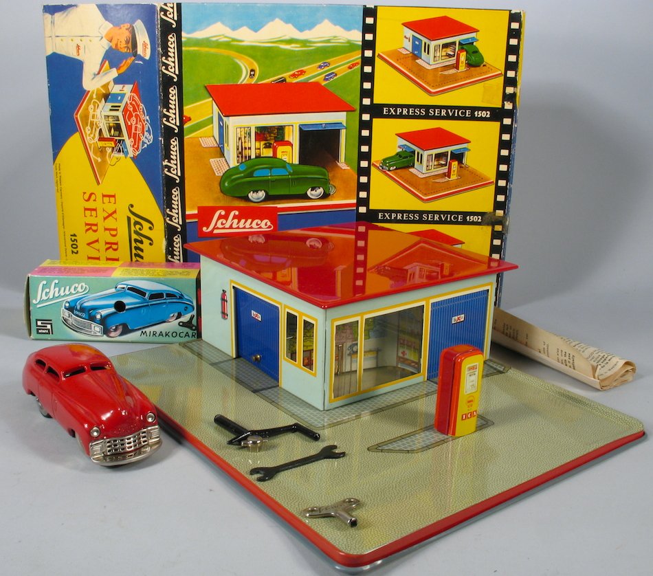 Schuco 1502 Express Station in the Box Pristine: Scarce Schuco German Gas Station in the original box. Pristine toy. Includes the car in the box, tools and key. Express Station is 9 inches wide.