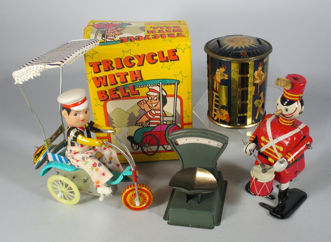 Lot of Tin Toys Linemar Drummer: Linemar (Japan Marx) soldier drummer wind up, Japan tin scale, English tin toy bank, and Red China bicycle wind up in the box.