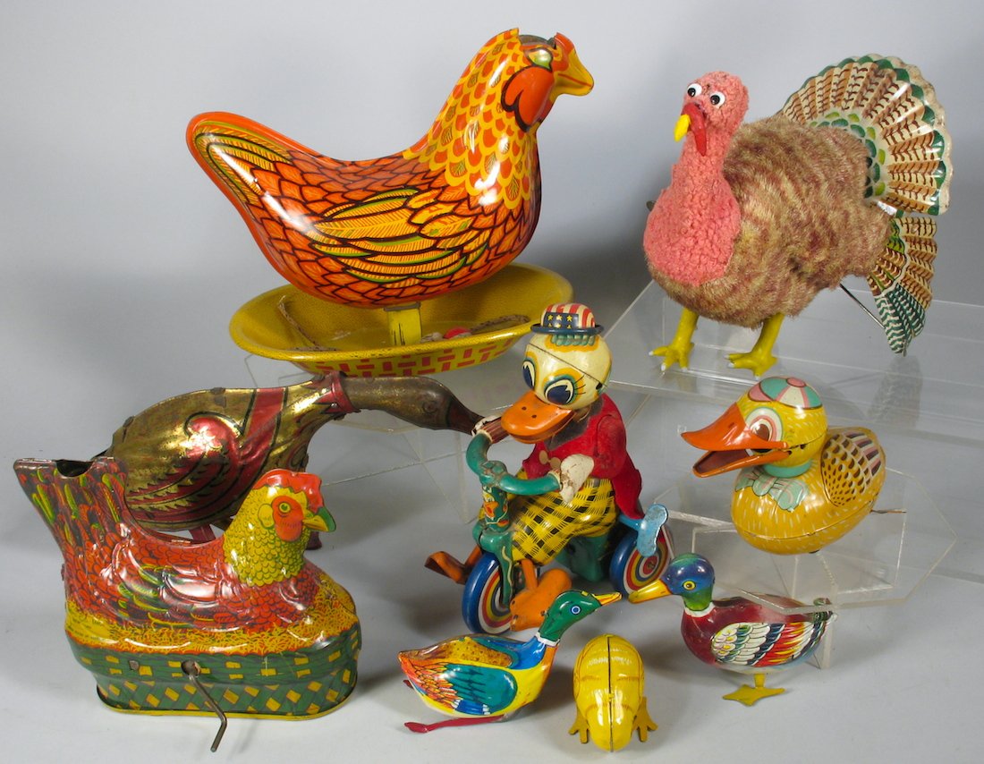 Duck, Turkey and Chicken Tin Toy Lot: Japan tin duck with Stars & Stripes hat on a tricycle, Turkey and duck toys. Baldwin tin chickens and Marx Goose.
