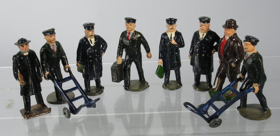 Britains Train Figures: 8 Pre-War Britains Train station figures.