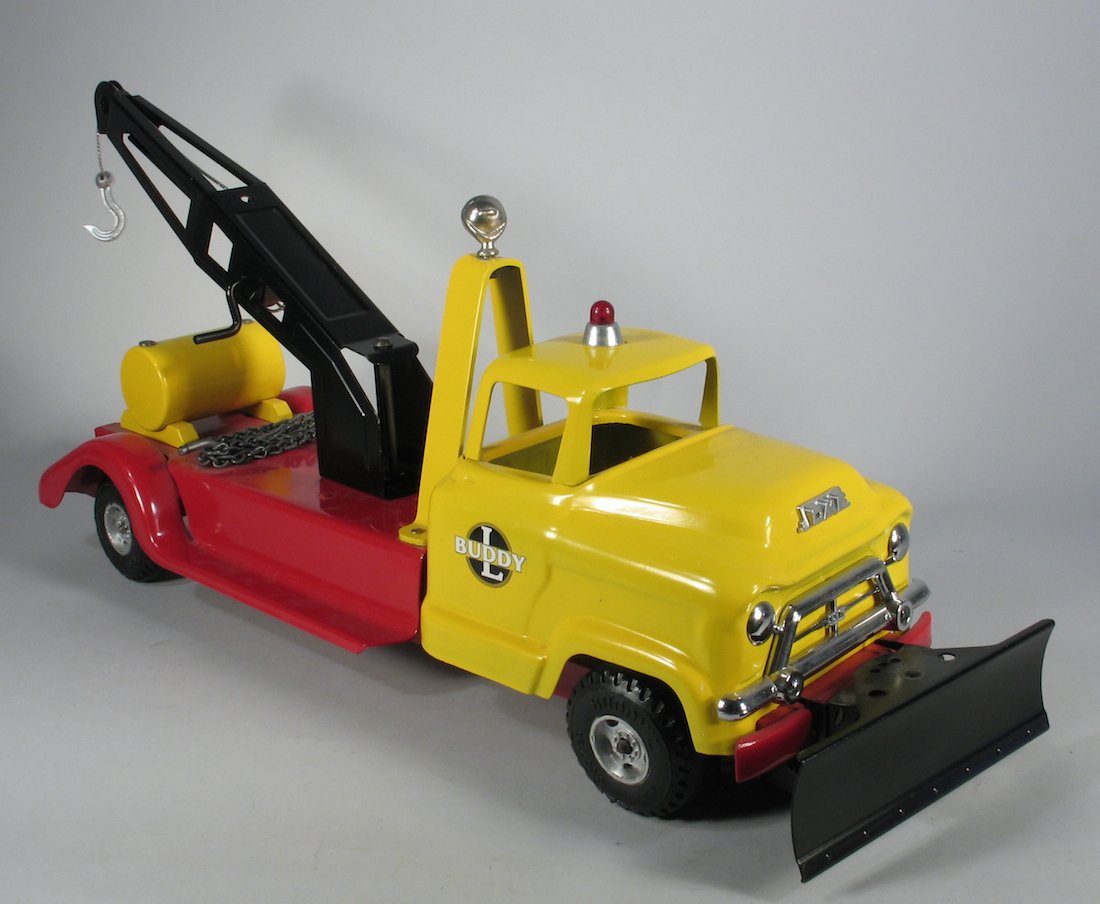 Buddy L Wrecker Truck with Plow: Pressed steel Buddy L Wrecker Truck in excellent condition. Measures 20 inches long.