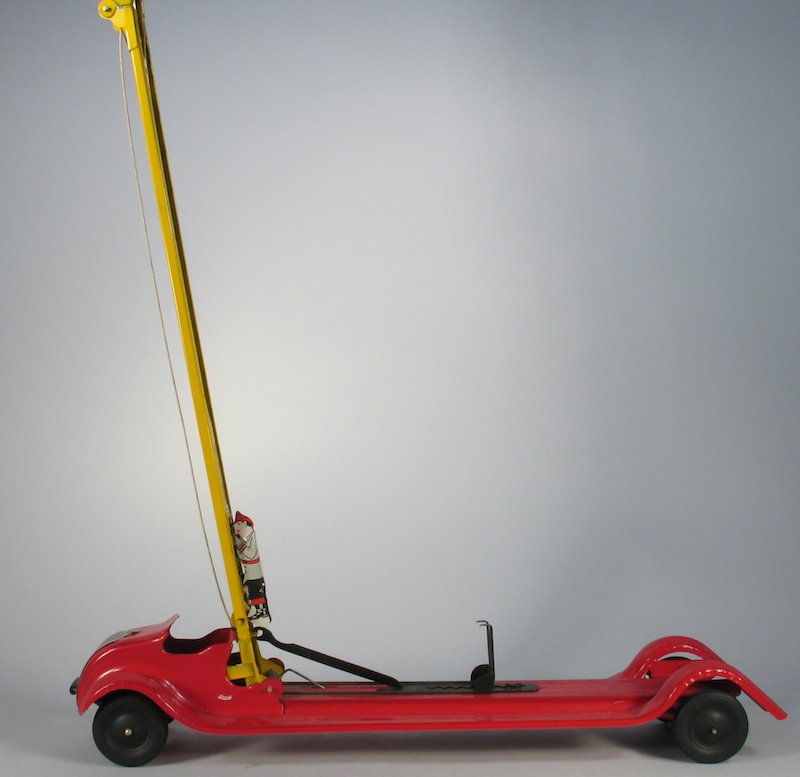 Keystone Pressed Steel Fire Engine & Climbing Fire: Keystone Fire Engine with bumper rise ladder and climbing tin fireman. Ladder measures 36 inches tall when extended. Truck is 21 inches long. Excellent condition. Measures 23 1/2 inches long