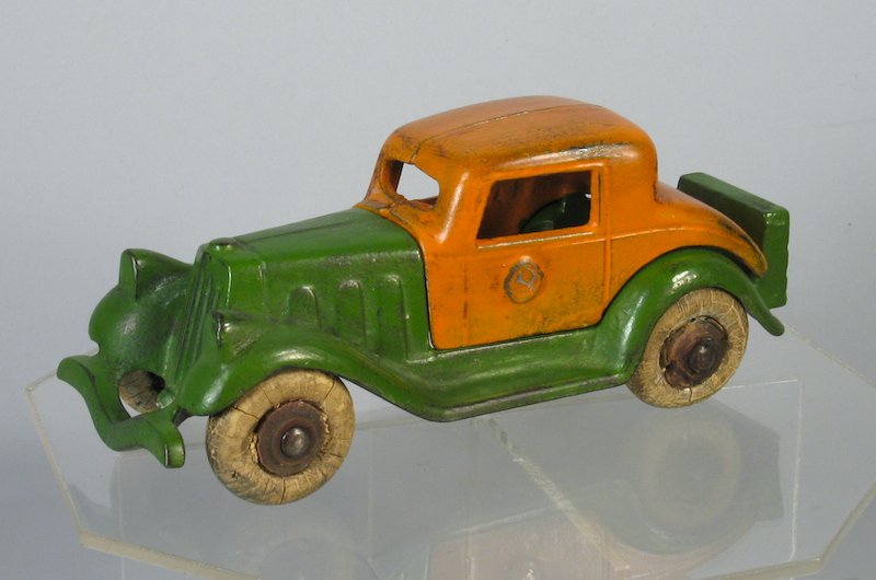 A C Williams Take Apart Cast Iron Packard: Large Two Tone cast iron coupe in excellent original paint. Measures 6 1/2 inches long.