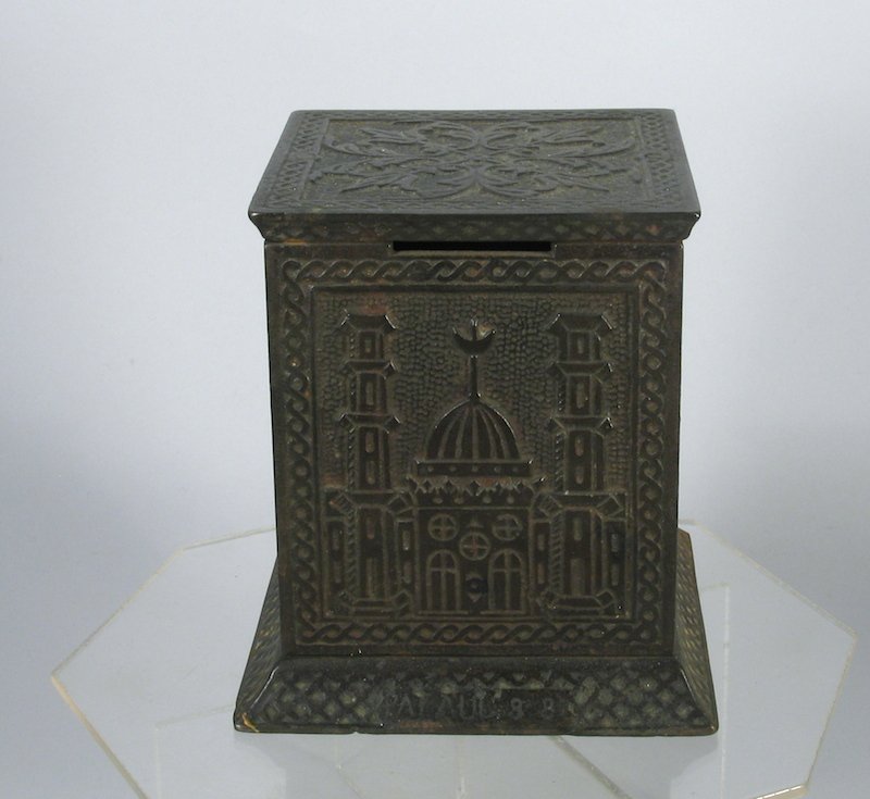 Arabian Safe Cast Iron Still Bank: Arabian Safe Bank Cast Iron Still Bank camels, palm trees, and Egyptian scenes embossed on sides. Measures 4 1/2 inches tall.