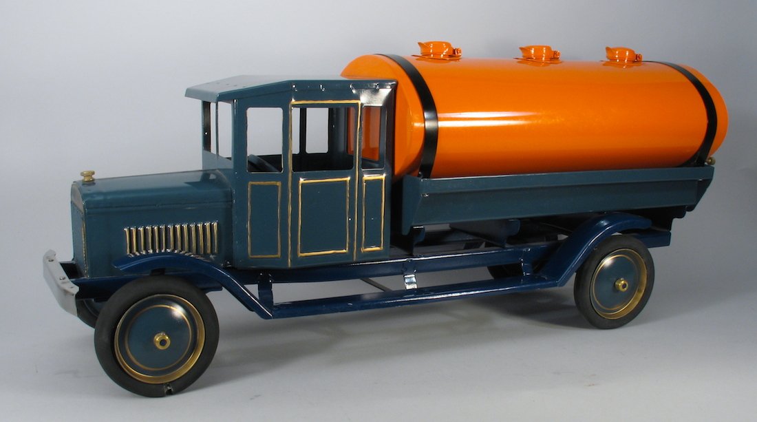 Large Cab Pressed Steel Tanker Truck: 1930s Buddy L Style large tanker truck. Contemporary possibly Les Paul edition well made truck measures 28 inches long. Beautiful 2 tone paint. Impressive tanker with elaborate cab. One rubber tire sp