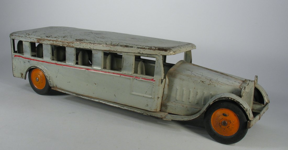 Cor Cor Pressed Steel Bus: Cor Cor 1930s Bus light pressed steel. Wear to finish, measures 24 inches long. One row of interior seats missing.