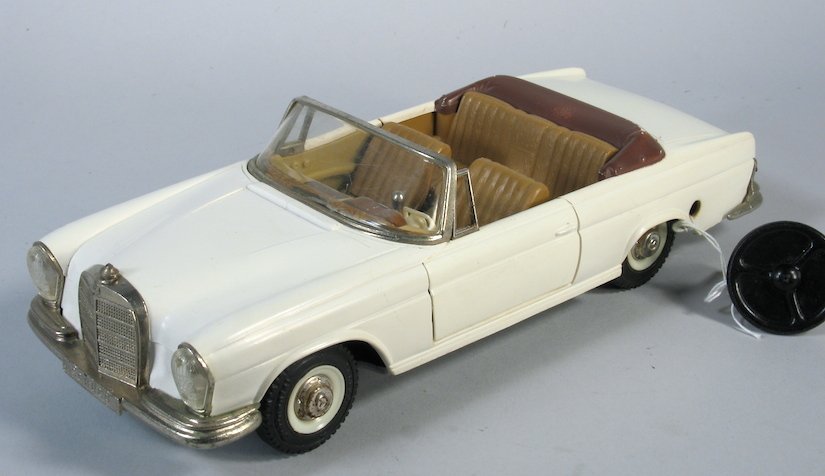 Schuco Mercedes Girato 4000: Schuco #4000 Girato Tinplate Mercedes Sports Car. Great condition measures 9 1/2 inches long. Comes with steering wheel piece, may be to a remote wire.