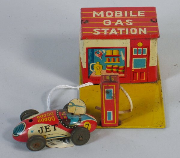 Japan Tin "Mobile" Mobil Gas Station & Jet Race Car: Japan Tin Mobile Gas Station garage with Jet Race Car Penny Toy. Measures 2 1/2 inches wide.