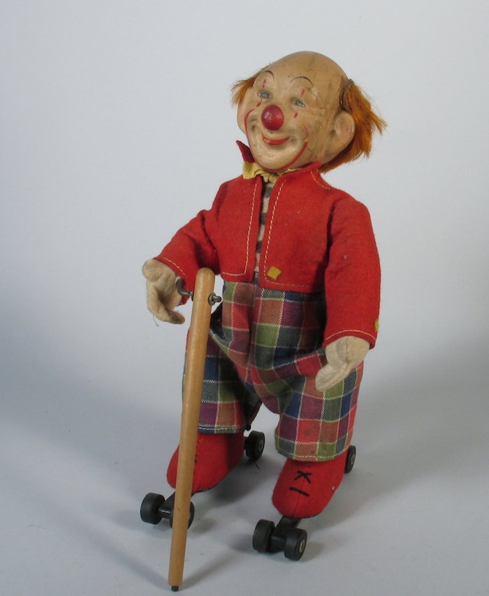Schuco Skating Rolly Clown Large Roller Skating Wind: Scarce Schuco German Rolly Clown wind up. Roller skating clown, working when tested. Made in U.S. Zone Germany. Measures 9 inches tall.