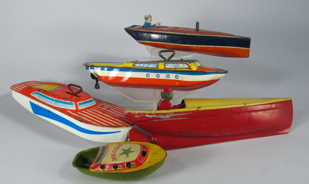 5 Tin Boats Unique Art, Japan, Lindstrom: 5 Tin toy boats sold as is. One unmarked is a steam alcohol burning put-put. Longest 9 inches.