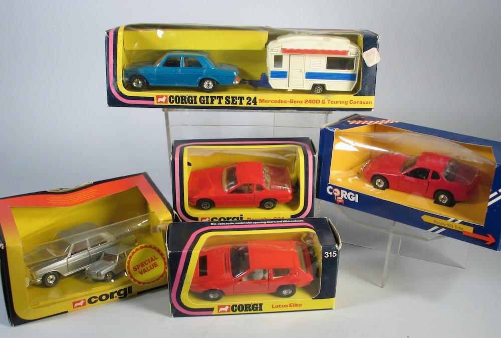 Boxed Corgi Toy Cars & Gift Set 24: Great mint lot of Corgi toys. Gift set 24 Mercedes-Benz 240D and Touring Caravan in the box, Porsche 924, Lotus Elite 315, Porsche 924, and Mercedes Duo. Gift set is 11 inches long.