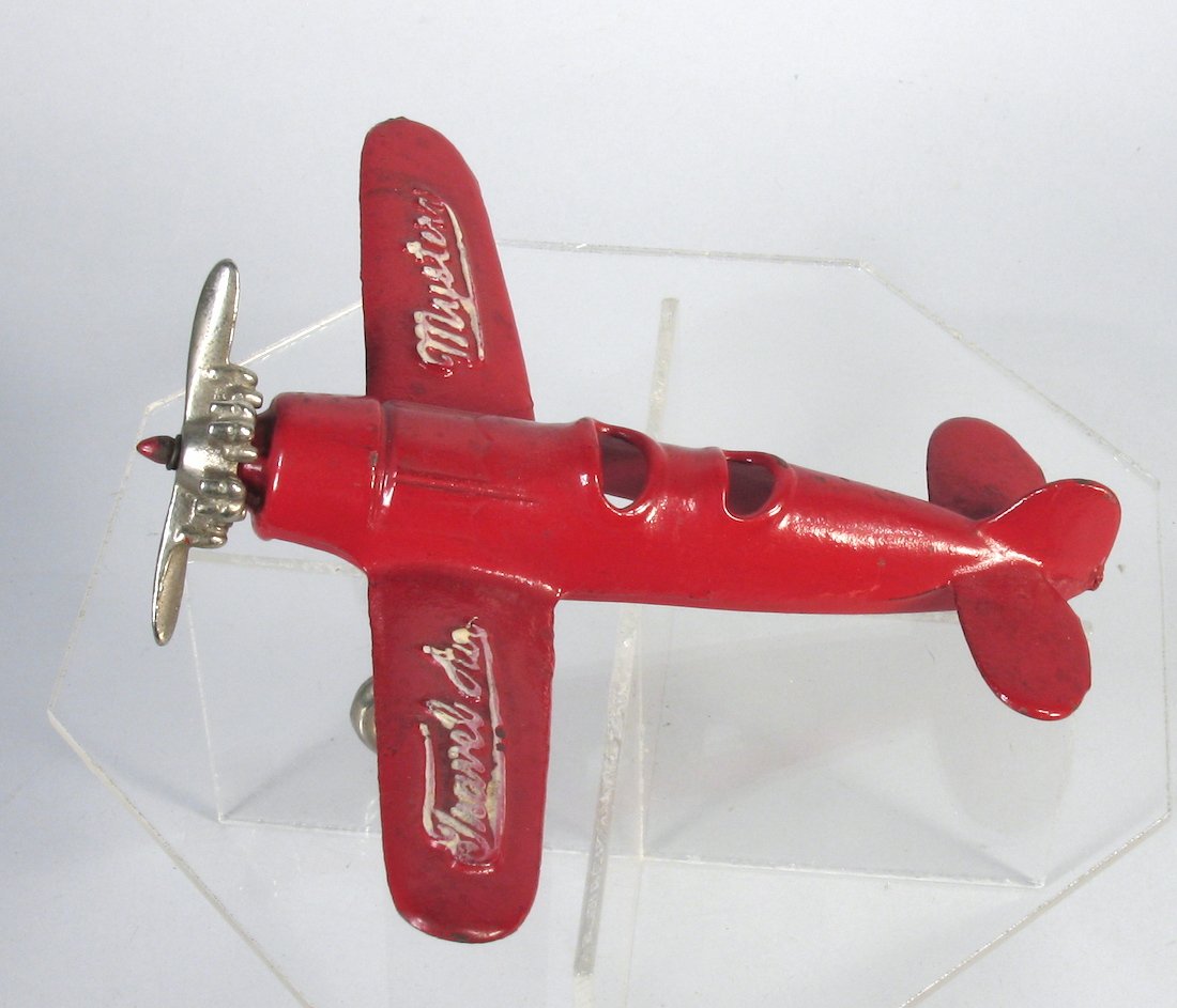 1930s Kilgore Travel Air Mystery Airplane: 1930s Kilgore Air Travel Air Mystery Airplane. Early cast iron aviation toy, one of the harder ones to find. Wingspan measures 7 inches.. Nickel prop and engine with embossed lettering. Repainted.