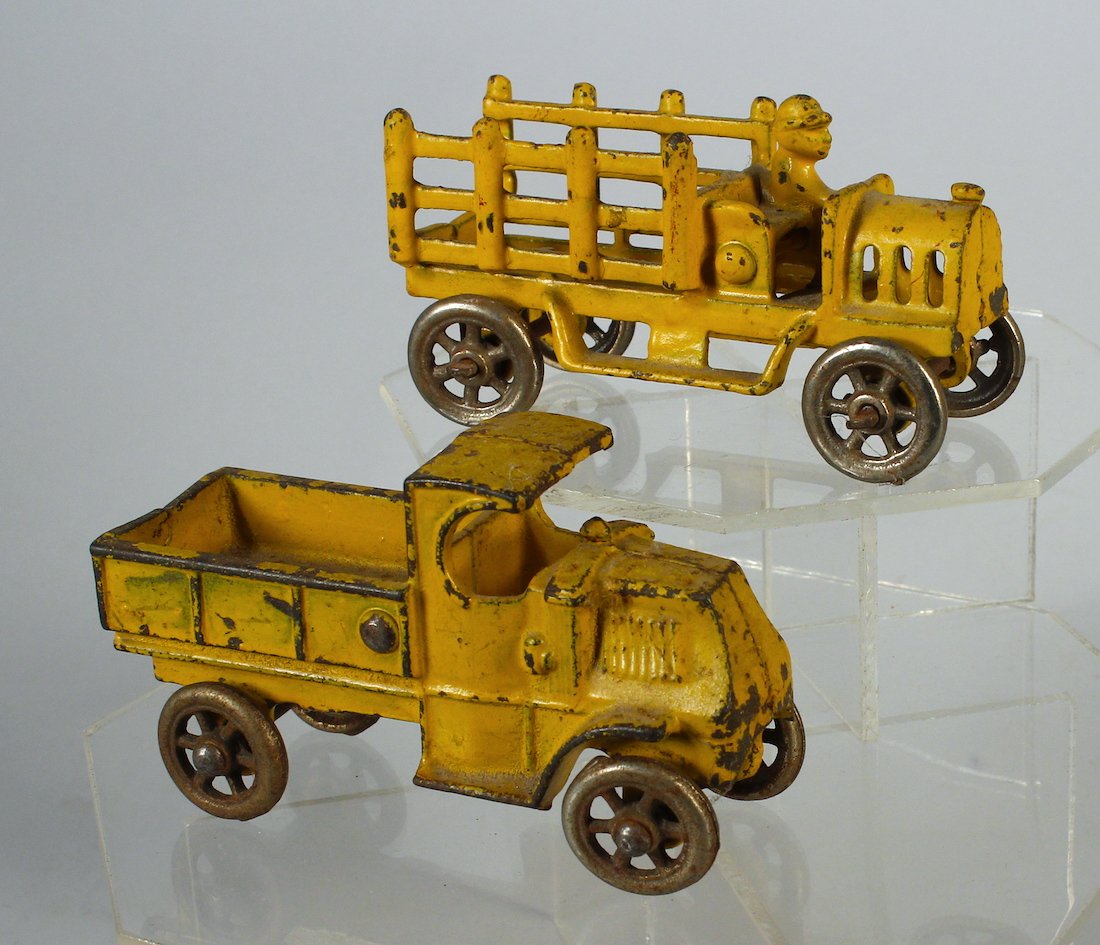 Cast Iron Yellow Construction Truck Pair Mack and Early: Cast Iron Yellow Construction Truck Pair -Stake and Mack Dump. 5 inches long.