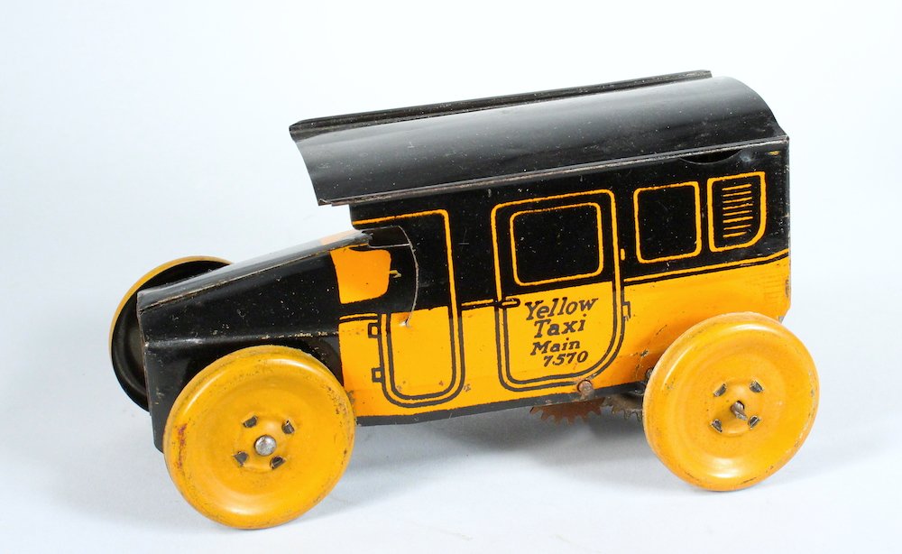 J. Chein Yellow Taxi Cab Early: J. Chein Yellow Taxi Cab. Early working wind up car. 6 inches long.