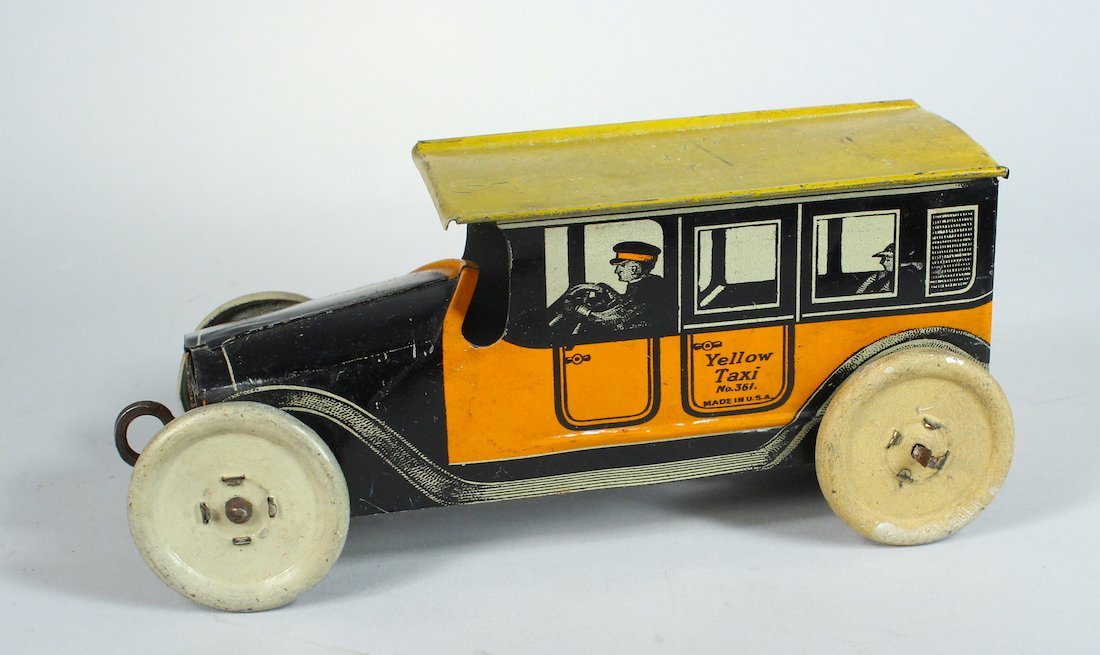 1918 Mohawk Toys Tin Checker Cab: 1918 Mohawk Toys Checker Cab. Early NY manufacturer later bought by Chein Checker Cab. Pull wind up. 6 1/2 inches long.