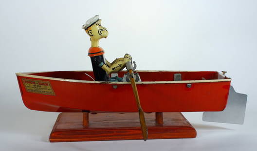 Hoge Popeye the Sailor In Rowboat No.268: Hoge Popeye the Sailor In Rowboat No.268. 1935 Iconic tin cartoon character toy of Popeye powering out a row boat with realistic rowing action. Copyright dated 1935 King Features Syndicate. Working. P