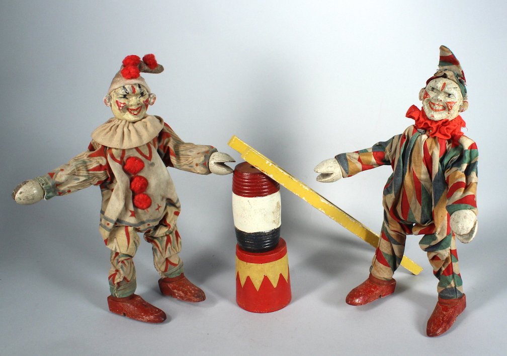 Schoenhut Clowns and Ladder: Schoenhut Clowns and Ladder with circus stands. Excellent colorful painted jointed clowns.with original clothes one in diamond cloth, 8 inches tall. Schoenhut of Philadelphia.This lot as well as the f