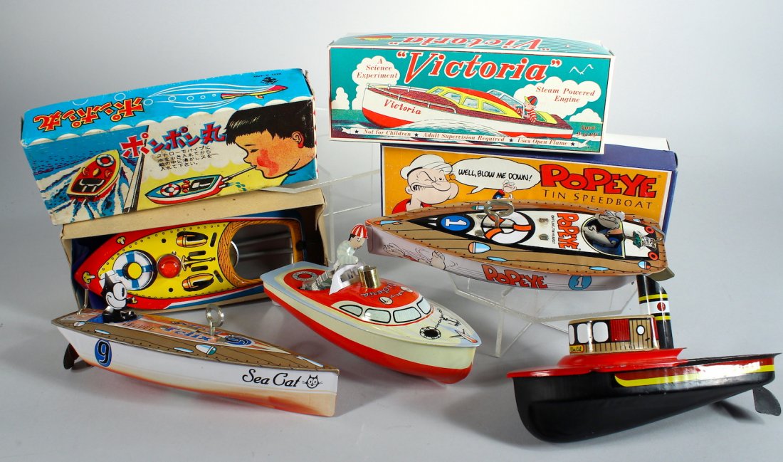 Group of Tin Boat Toys Popeye Contemporary: Group of Tin Boat Toys Popeye, Felix Sea Cat, Victoria, Putt-putt, tin boats in the box. Contemporary, near mint.