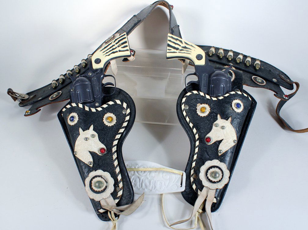 Nichols Cap Gun Set & Top Hand Double Holster Belt: Nichols Cap Gun Set & Top Hand Double Holster Belt and bullets. Elaborate tooled holter with learther and jeweled horses.