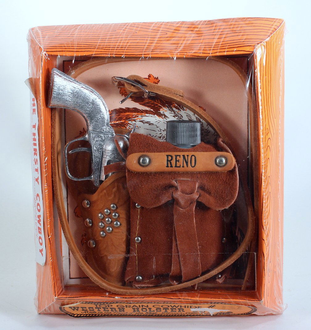 Thirsty Cowboy Reno Cap Gun, Flask, Holster Mint: Thirsty Cowboy- Cap Gun, Flask, and Holster mint in the package. Cowhide western holder and flask cover. Scarce cap gun. Gun 6 inches.