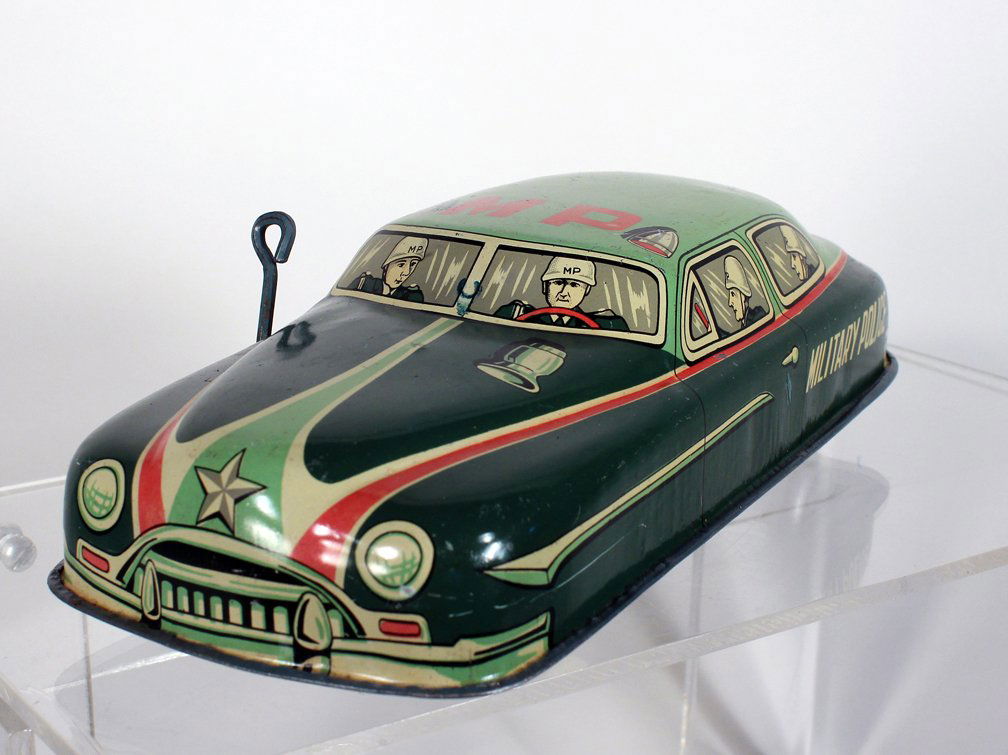 Cragstan Japan Tin MP Military Police Car: Cragstan Japan Tin MP Military Police Car. Scarce tin Japan Post-War Car. 8-9 inches long.