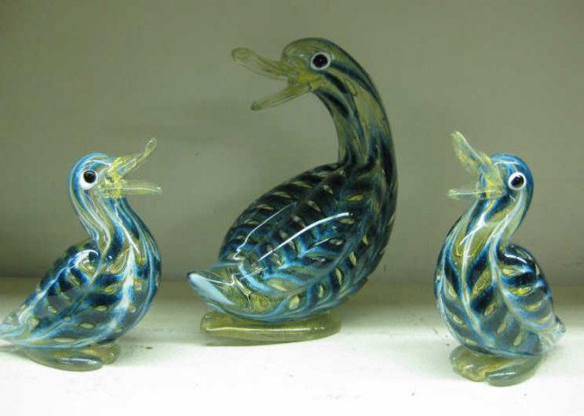 BAROVIER AND TOSO, MURANO: Three blown art glass ducks with blue, clear white and gilt, one bearing red label, comprising one large and a pair of smaller. large: 8 3/4 x 7 inches pair small: 6 x 5 inches