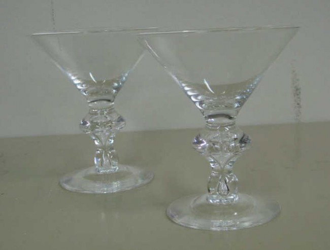 SIDNEY WAUGH FOR STEUBEN: Ten trumpet-shaped champagne glasses. 4 7/8 x 4 3/8 inches, signed.