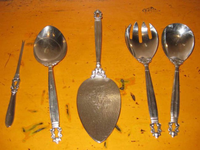 JOHAN ROHDE FOR GEORG JENSEN, DANISH: ACORN (pattern 62), five-piece sterling silver serving flatware: pair salad servers, engraved pastry server, lobster pick and large serving spoon, signed with Georg Jensen in dotted oval, 15 troy ounc
