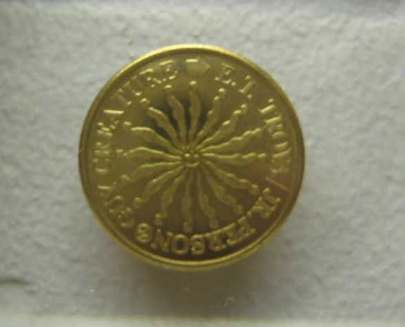 ERNEST TROVA, AMERICAN (1927-2009): FALLING MAN GOLDINE COIN, 1969, Guy Creature/Ernest Trova/JR. Person, contained in an acrylic casing. 3 1/4 x 3 1/4 x 1 inches