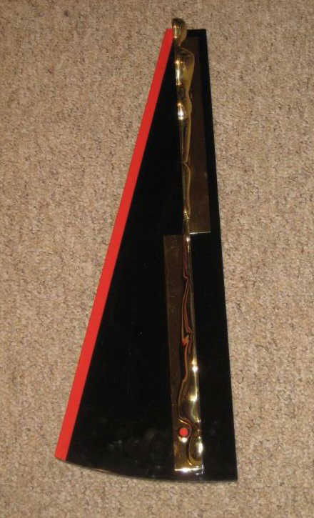 ERNEST TROVA, AMERICAN (1927-2009): Falling man, circa 1966-69, plated bronze figure on plastic base. 24 1/4 x 8 1/2 x 3 inches