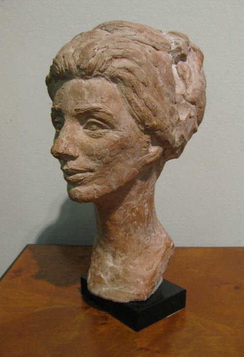 RUTH KELLER SCHWEISS, ST. LOUIS: Bust length portrait of a woman, red clay, signed verso, on black marble pedestal base. 10 1/4 inches