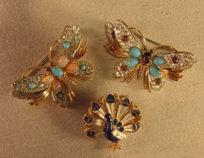 THREE COSTUME BROOCHES: Trifari enameled Peacock and a pair of butterflies.