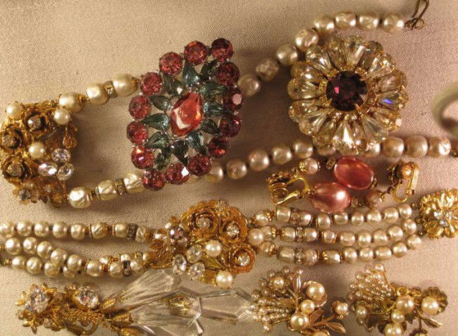 COSTUME JEWELRY COLLECTION: Miriam Haskell floriform brooch, pair Miriam Haskell spray earrings, pair Miriam Haskell drop earrings, Robert drop earrings, Original by Robert flower clasp necklace and matching bracelet and a rhine