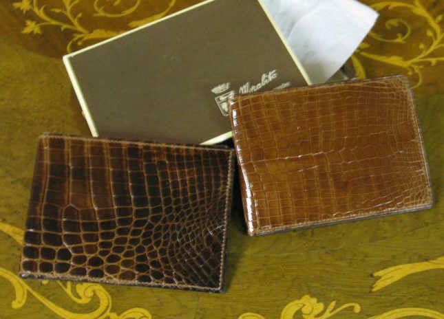 MORABITO, 1. PLACE VENDOME, PARIS: Two men's brown leather wallets.