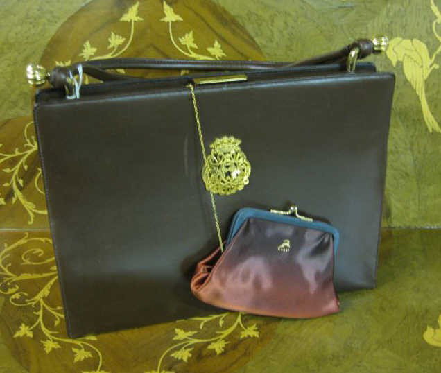 KORET: Brown leather handbag with coin purse, like new condition.