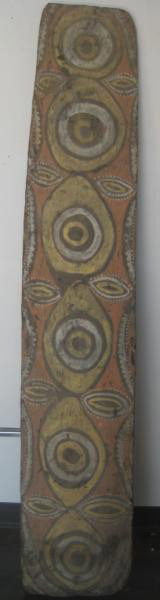 SWAGUP VILLAGE CLAN TOTEMIC SHIELD: Upper Sepic (Sundaun Region) New Guinea, natural pigments of black, white, yellow and orange on geometric carved wood, height 68inches.