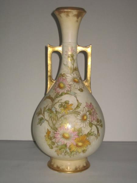 ROYAL BONN POTTERY VASE: Footed bottle-form with applied two angular handles, hand painted floral decoration on each side on cream ground, bearing mark of F. A. Mehlem, Bonn, early 20th century. Height 16 in.