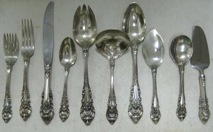 WALLACE SILVERSMITHS, WALLINGFORD, CT: Sterling silver "Sir Christopher" pattern flatware ensemble comprising 7 dinner knives (9 1/8"), 7 forks, 12 salad forks, 14 teaspoons, 2 table spoons, a iced-tea spoon, salad serving fork, gravy ladl