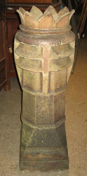 ENGLISH 19TH CENTURY TERRA COTTA CHIMNEY POT: Crown form top with nine point, above the horizontal vents, octagonal stem down to the square base. Height 42 1/2 in.