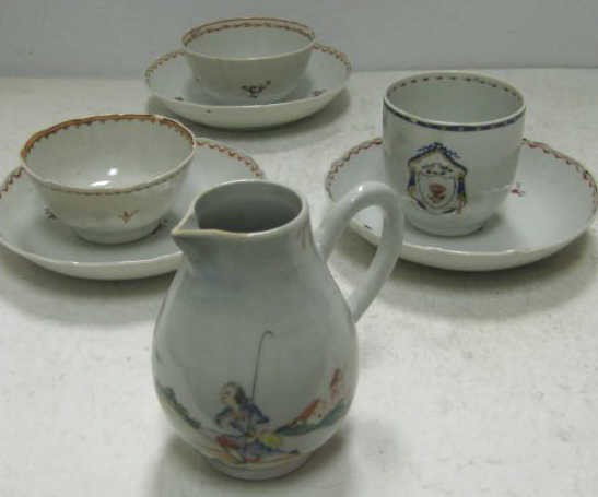 COLLECTION OF CHINESE EXPORT PORCELAIN: Hand painted decoration; cream pitcher with romantic scene in landscape, armorial cup, two tea bowls and three saucers with floral decoration, 19th century, total 7 pieces.