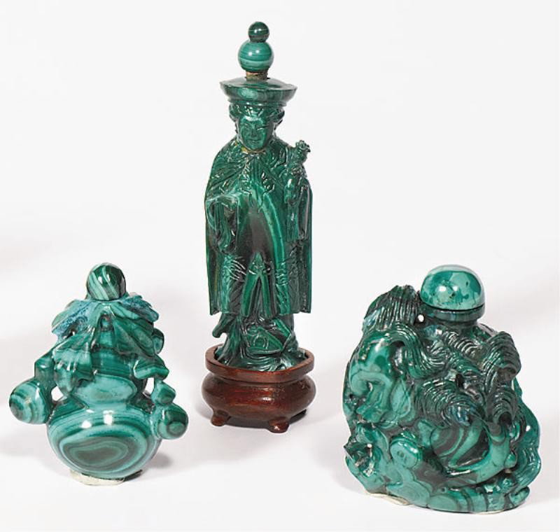 THREE CHINESE MALACHITE SNUFF BOTTLES: Finely carved climbing horse group amidst trees, standing figure with scepter and a gourd, 20th century. Heights: 2 3/8 to 3 7/8 in.