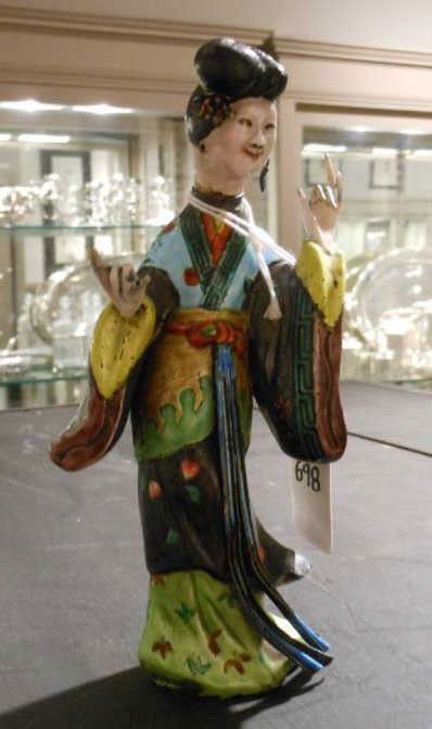 CHINESE ENAMEL SILVER FIGURINE: A lady wearing bright enamel painted robe, removable head, marked on the bottom, 19th century, repainted face. Height 6 7/8 in.