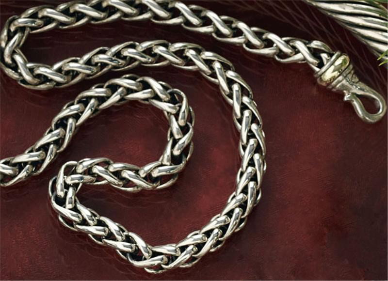 SILVER CABLE CHAIN, YURMAN: Sterling silver cable link chain with 14k gold accents. 16 inches. Designer David Yurman.