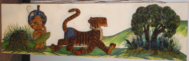 ART GLASS WINDOW PLAQUE: Rectangular, showing a sad Sambo, and a tiger walking away towards trees, through access behind figures for lighting. 15 x 52 in. From the last Sambo's restaurant in St. Louis.