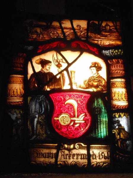 ANTIQUE CONTINENTAL STAINED GLASS WINDOW: depicting a female and man with red crest having a plow, "Marie Wrserm?? 1561", looks to be leaded from a larger panel.14 1/4 inches x 10 1/4 inches.